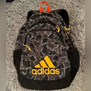 Adidas Gray Camouflage Backpack with Yellow Details it’s in great and by
